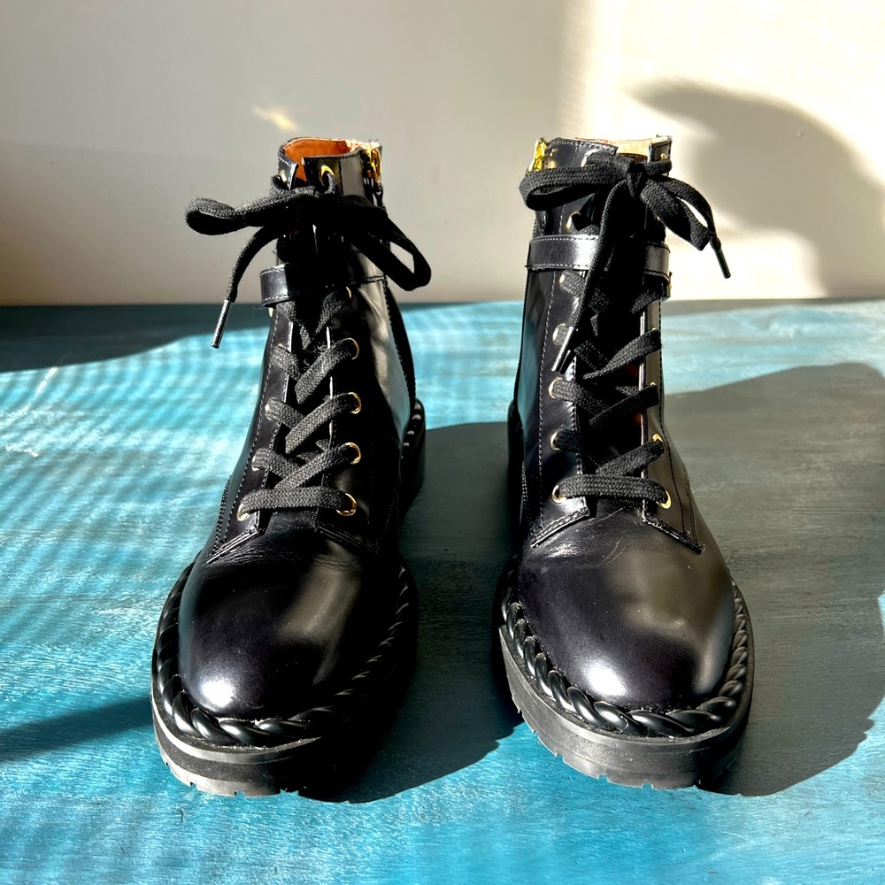 Louise et Cie combat style ankle boot with gold hardware detail.